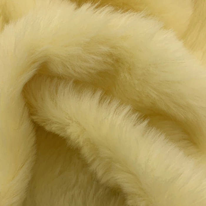 Muestra de tela peluche color beige, textura de pelo.
