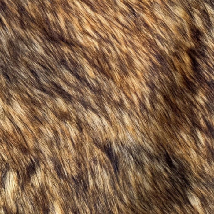 Muestra de tela peluche color canela jaspeado, textura de pelo.