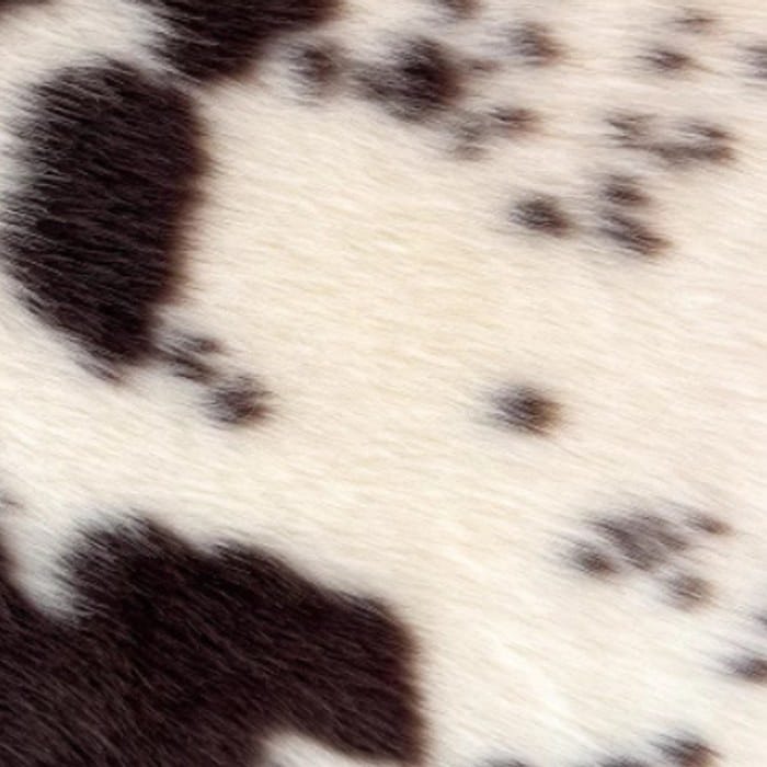 Muestra de tela peluche color dálmata premium, textura de pelo.