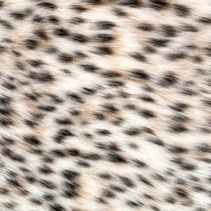 Muestra de tela peluche color leopardo, textura de pelo.