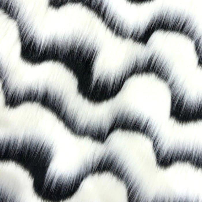 Muestra de tela peluche color ondas blanco y negro, textura de pelo.